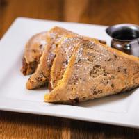 Riviera French Toast · Made with thick slices of our cinnamon bread, topped with powdered sugar, served with warm m...