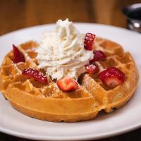 Belgian Waffle · Traditional Belgian waffle topped with strawberries and whipped cream, served with warm mapl...