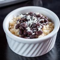 Rice & Beans · Spanish rice and Cuban-style black beans and topped with queso fresco.