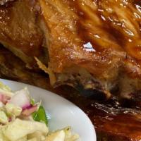 Lunchtime Ribs · Fall of the bone baby back ribs, grilled over an open flame and served with Texas slaw and f...