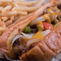Philly Steak & Cheese · Shaved ribeye, Cheddar cheese, peppers, and onions on a hoagie roll.