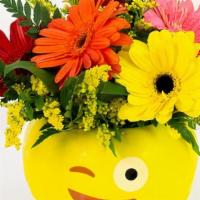 Flirtatious Daisies · Assorted Gerbera dasies are accented with yellow solidago in a ceramic wink emoji container!...