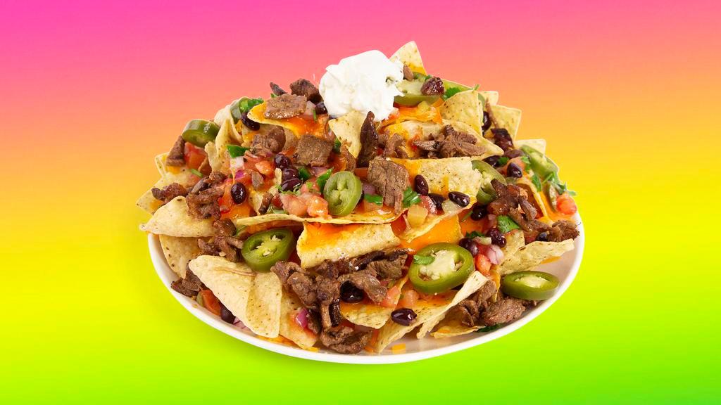 Carne Asada Nachos · Melty nachos loaded with carne asada, melted cheese, pico de gallo, black beans, and your choice of additional toppings.
