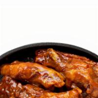 Wings · Classic bone-in wings oven- baked, cooked to order perfectly crisp, tossed with your choice ...