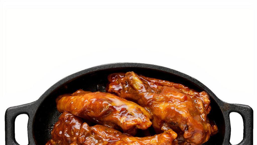 Wings · Classic bone-in wings oven- baked, cooked to order perfectly crisp, tossed with your choice of delicious sauces.