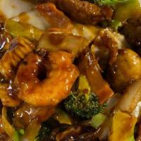 Triple Delight · Jumbo shrimp with chicken, beef and vegetables in brown sauce.