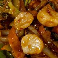 Jumbo Shrimp & Scallops With Garlic Sauce · Jumbo shrimp and fresh scallops stir fried with broccoli, water chestnuts and a variety of C...