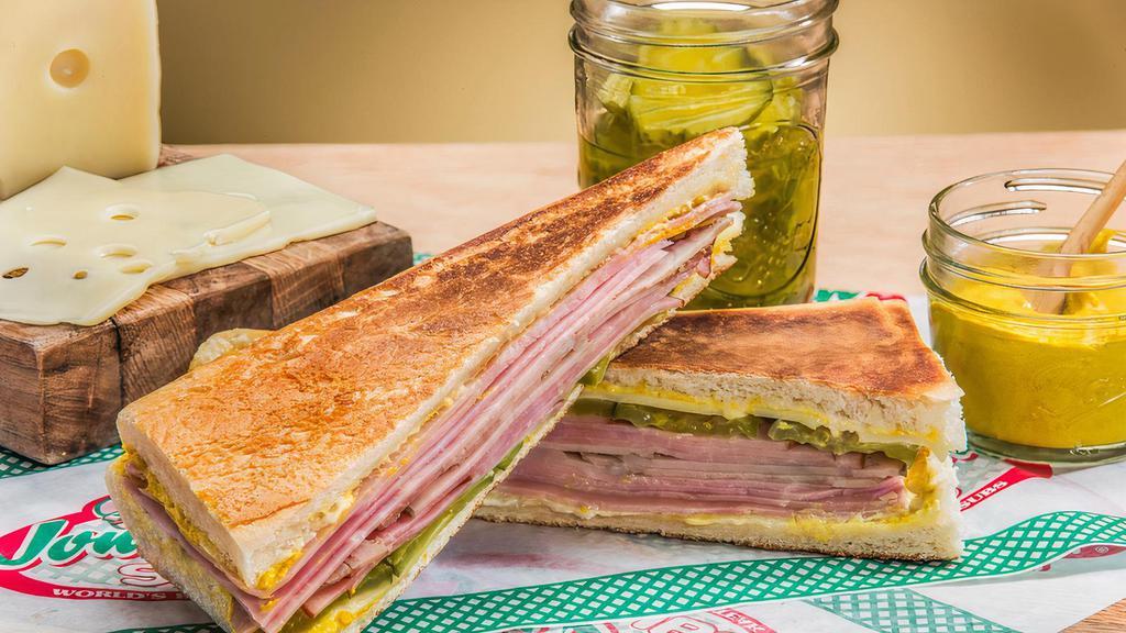 The Cuban · 760 calories. Smith's new classic. Smoked Virginia ham, mojo pork, boiled ham with pickles, Swiss, Hellmann's mayo and yellow mustard served on real Cuban bread.