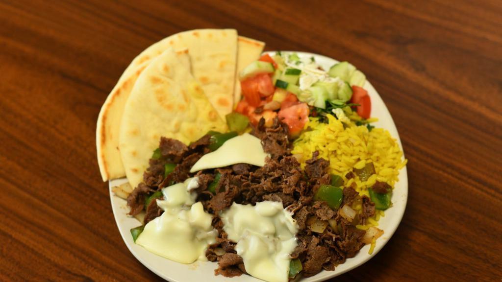 Philly Cheese Steak Platter · Served with Philly cheese steak and rice, your choice of salad, and pita bread.