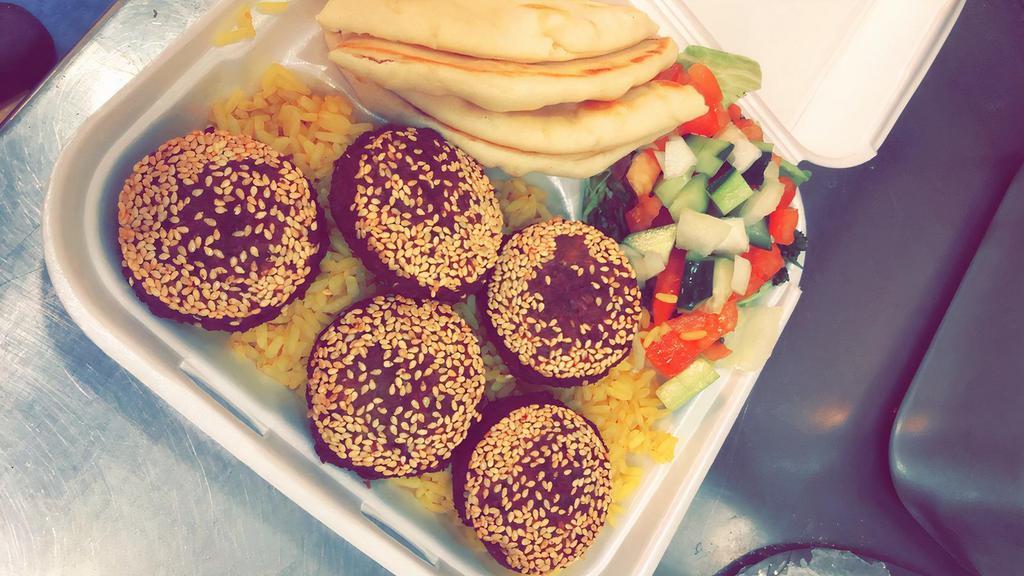 Falafel Platter · Served with falafel and rice, your choice of salad, and pita bread.