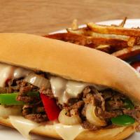 Philly Cheese Steak Sandwich · With grilled green peppers and onions your choice of veggies, cheese, served in a fresh roll.