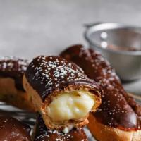 Eclair · a small, soft, log-shaped pastry filled with our family recipe custard and typically topped ...