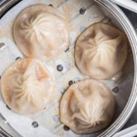 Shanghai Soup Dumplings · Four pieces. Steamed mini dumplings stuffed with pork and scallion. Comes with a side of our...
