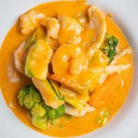 Thai Red Curry · spicy, gluten free. homemade red curry with coconut milk served with carrots, onions, cabbag...