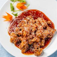 Sesame Chicken · Deep-fried, breaded chicken sautéed in sweet special brown sauce with sesame seeds.
