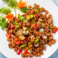 Black Pepper Chicken · Spicy. Lightly breaded diced chicken sautéed with diced bell peppers and onions in a black p...
