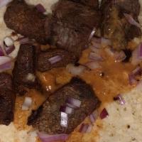 Authentic Taco · Corn or Flour. Single steak taco choice of tortilla topped with onions, cilantro, and chipot...