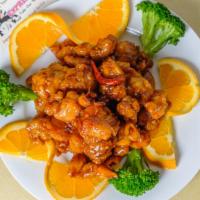 General Tsaos Chicken · Served with fried rice and an egg roll.