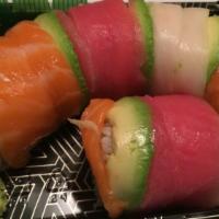 Rainbow Roll · Eight pieces. Snow crab roll inside, topped with sliced tuna, salmon, and white tuna.