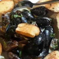 Mussels · 18 - 20 Mussels cooked in our homemade Green Thai Curry sauce served with toast points.