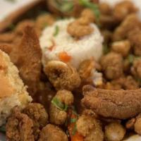 Seafood Creole · Fish, popcorn shrimp, calamari & bay scallops sautéed with peppers, onions, and celery in a ...