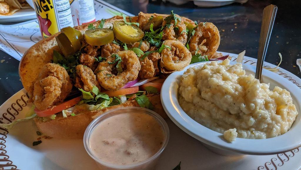Chilly Willy'S Po Boy · Your choice of seafood (fish, calamari, bay scallops, popcorn shrimp) served with lettuce, tomato, onion, cilantro, jalapeño and remoulade.