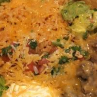 Ground Beef Ensalada Supreme · Fried tortilla shell filled with romaine lettuce, rice, beans, topped with cheddar cheese, g...