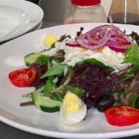 Greek Salad · Mixed greens, feta cheese, kalamata olives, cucumbers, banana peppers, red onions, and tomat...