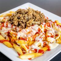 Papas Locas / Crazy Fries · Papas fritas, con queso fundido, pollo o carne asada, mayonesa y ketchup

(French fries, wit...