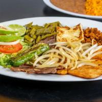 Campechano · Cecina, chorizo y pollo, acompañado con arroz, frijoles ya ensalada.

(Steak, chorizo and ch...