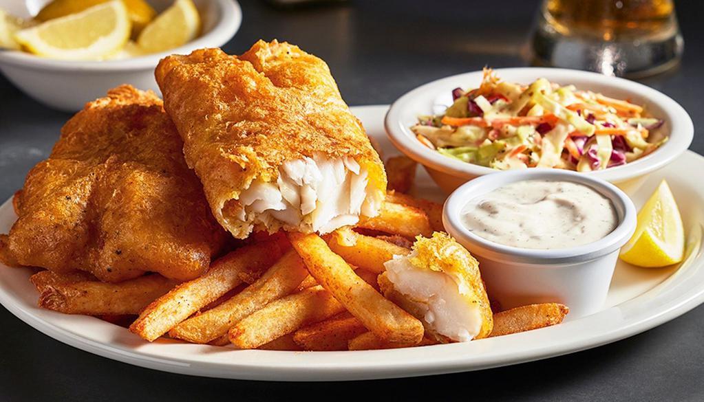Fish & Chips · Wild caught North Atlantic cod fillets, beer battered and fried crispy, with tartar sauce, cole slaw and seasoned fries.