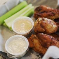 Wings · Wings tossed in your choice of buffalo, BBQ, or dry rub. Side of signature ranch and celery.
