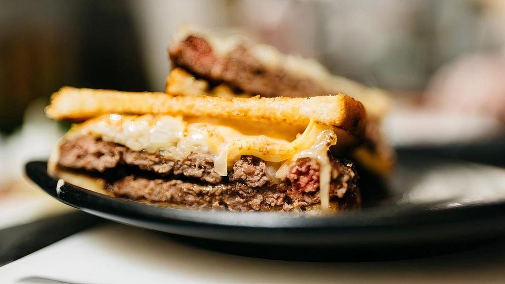 Ground Melt · Two 1/3 lb. beef patties topped with caramelized onions, Swiss and American cheese, homemade 1,000 Island dressing, on sourdough bread. Comes with choice of side and optional 1 ranch or 1 spicy ranch, any additional sauces cost .50 per & can be found in sauces & sides tab.