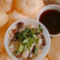 Pani Puri (8) · Vegan. Crispy round puffs, stuffed with the mixture of mashed potato and chickpeas. Served w...