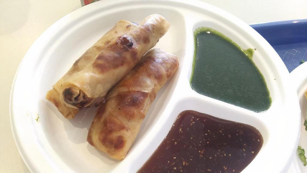 Chicken Spring Rolls (3) · Light crispy pastry filled with seasoned chicken and fried. Served with tamarind mint chutney.