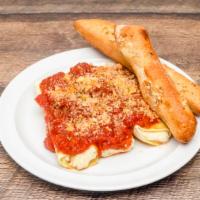 Cheese Manicotti · Pasta all stuffed with ricotta, Parmesan, and mozzarella. Baked with marinara, topped with m...