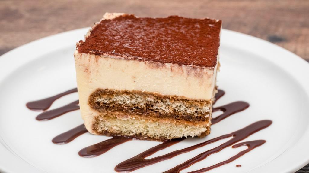 Tiramisu · Two delicate layers of sponge cake saturated with espresso coffee and marsala, then combined with a thick creamy layer of filling and mascarpone.