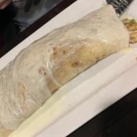 La Chiquita Xl Burrito · A large flour tortilla filled with your choice of meat (steak, chicken, or ground beef) comb...