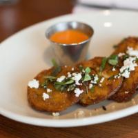 Fried Green Tomatoes · Vegetarian. Served with goat cheese, basil, and roasted red pepper vinaigrette.