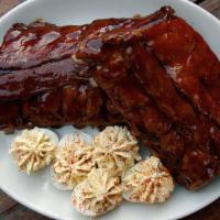 Smoked Carolina Style Ribs (Half Rack) · Gluten-free. More bone, more flavor! Served with choice of two sides.