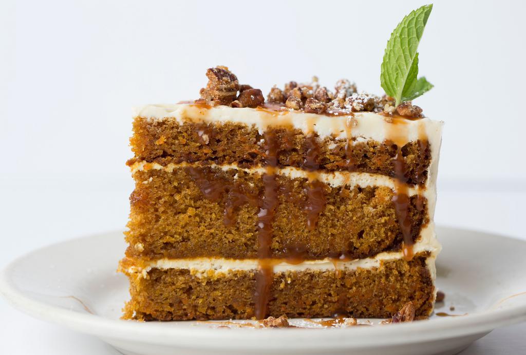 Carrot Cake · With cream cheese frosting, pecans, and caramel.