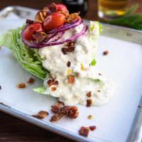 Wedge Salad · Iceberg lettuce, shaved onion, blistered cherry tomato, bacon, and smoked bleu cheese dressi...