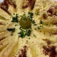 Hummus · Served with fresh pita bread.