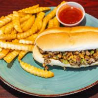 Philly Cheesesteak & Fries · Classic steak  sandwich sauteed with onions and green peppers smothered in cheese.