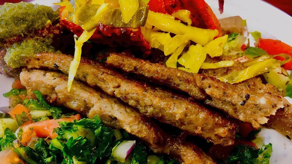 Gyro Platter · Seasoned strips of beef and lamb served with greek salad, hummus, baba ghannouj, tzatziki & pita.