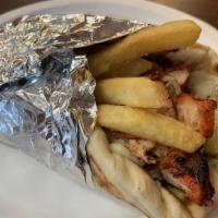 Chicken Shawarma Wrap · With potato strips, pickles, & garlic sauce.