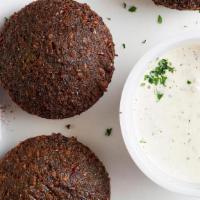 Falafel (6) · Ground chick peas with onions, garlic and parsley served with sesame tahini.