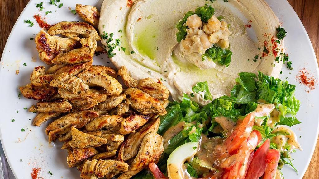 Chicken Shawarma · Sliced rotisserie style chicken marinated with garlic, white vinegar and spices.