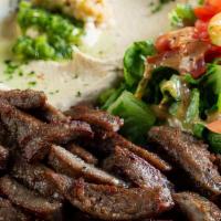 Gyro Plate · Spiced lamb and beef topped with tahini sauce.