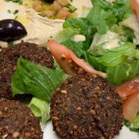 Falafel Plate · Ground chick peas, onions, parsley and garlic, blended with seasoned and fried to perfection.